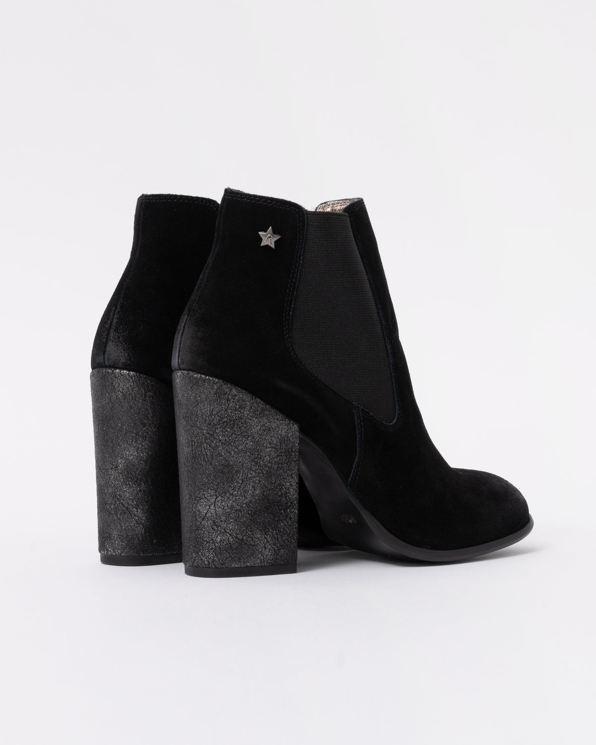 Black ankle boots with block heels on a white background