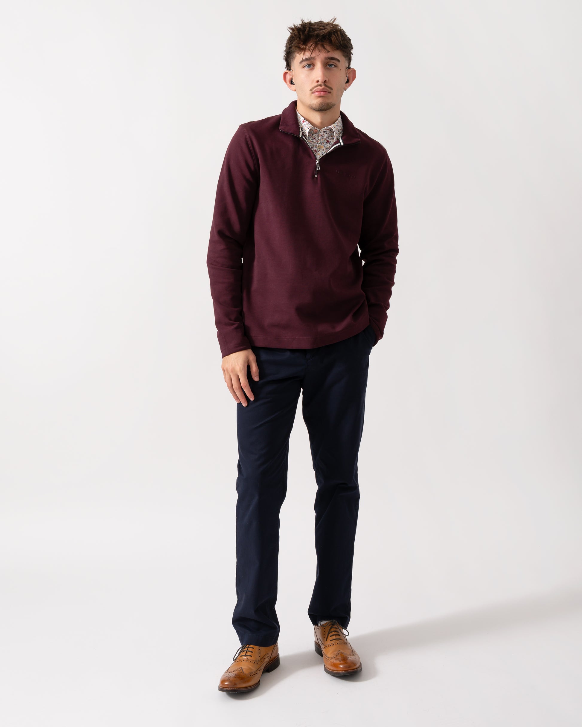 Full length shot of a Model wearing a Ted Baker Actos Mens 1/4 Zip Sweatshirt in Maroon