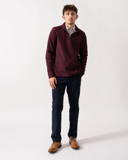 Full length shot of a Model wearing a Ted Baker Actos Mens 1/4 Zip Sweatshirt in Maroon