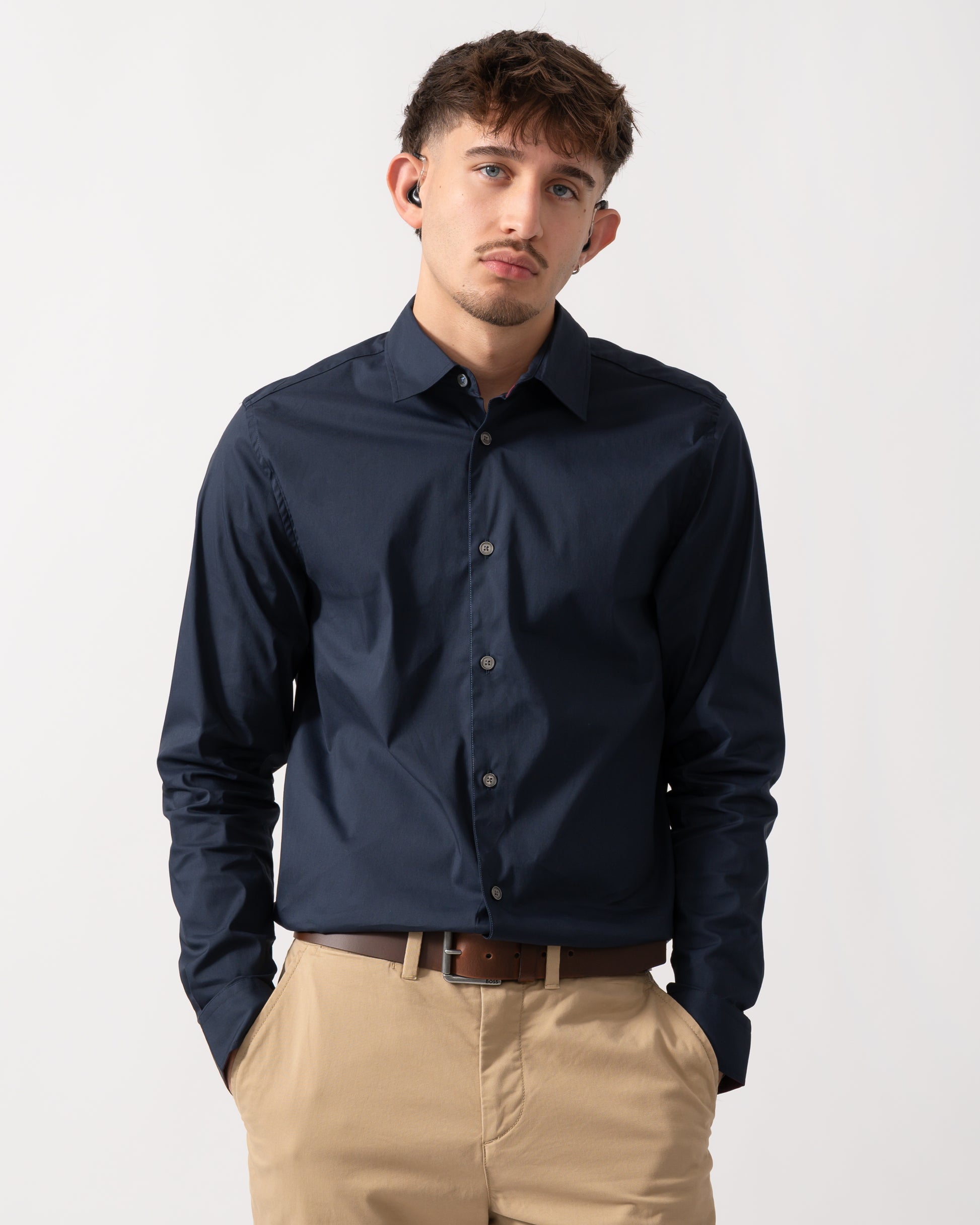 Model wearing a Ted Baker Baxters Mens Long Sleeve Slim Stretch Shirt in Navy
