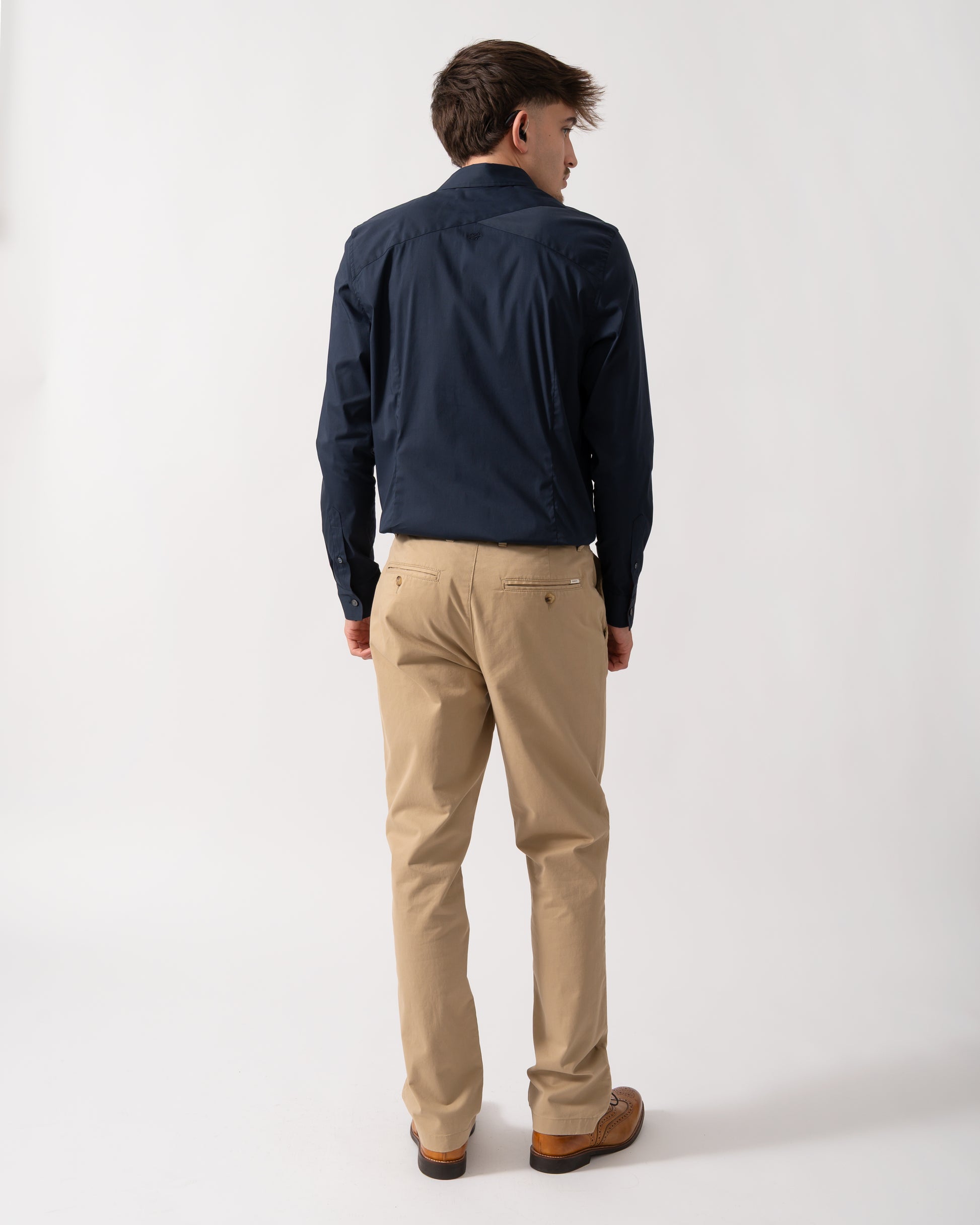Back shot of a Model wearing a Ted Baker Baxters Mens Long Sleeve Slim Stretch Shirt in Navy