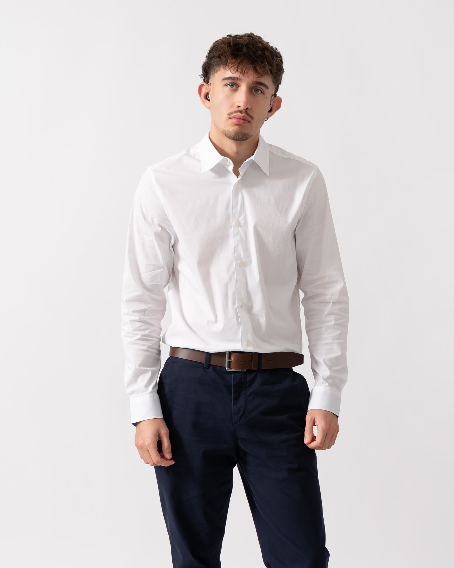 Model wearing a Ted Baker Baxters Mens Long Sleeve Slim Stretch Shirt in White