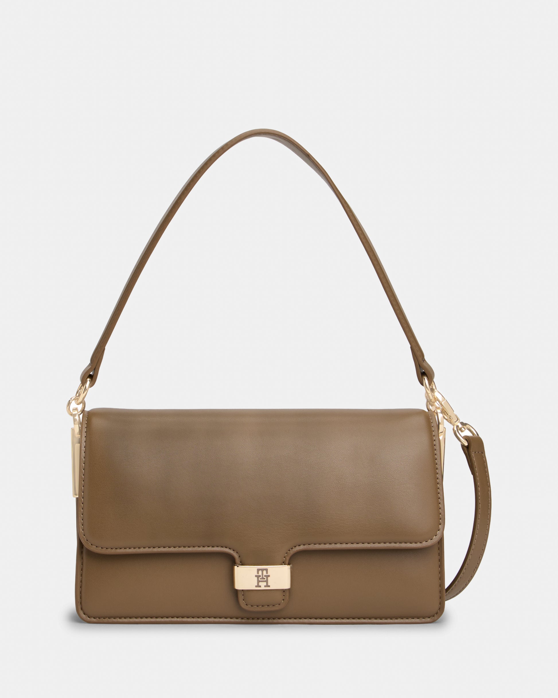 Brown Tommy Hilfiger handbag with a gold clasp on a light grey background