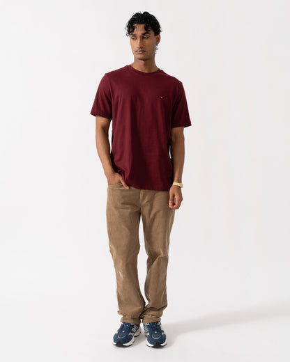 Man wearing the Tommy Hilfiger Essential Seasonal Regular Fit Solid Mens T-Shirt - Burgundy