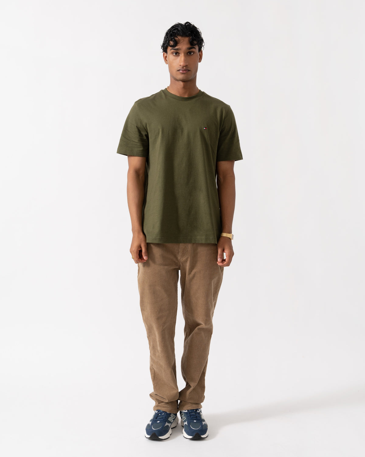 Man wearing the Tommy Hilfiger Essential Seasonal Regular Fit Solid Mens T-Shirt - Huntsman Green