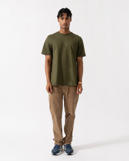 Man wearing the Tommy Hilfiger Essential Seasonal Regular Fit Solid Mens T-Shirt - Huntsman Green