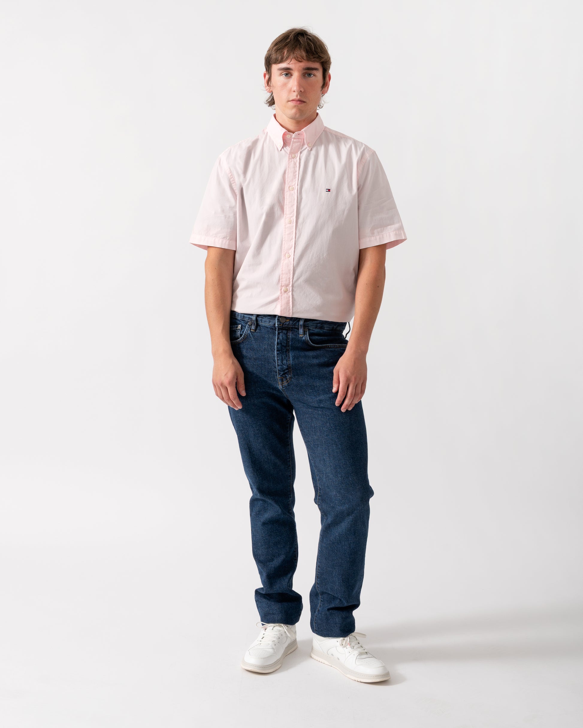 full length of model wearing a Tommy Hilfiger GMD Poplin Mens Short Sleeve Shirt in Pink Lily
