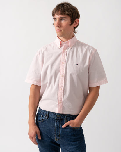 model wearing a Tommy Hilfiger GMD Poplin Mens Short Sleeve Shirt in Pink Lily