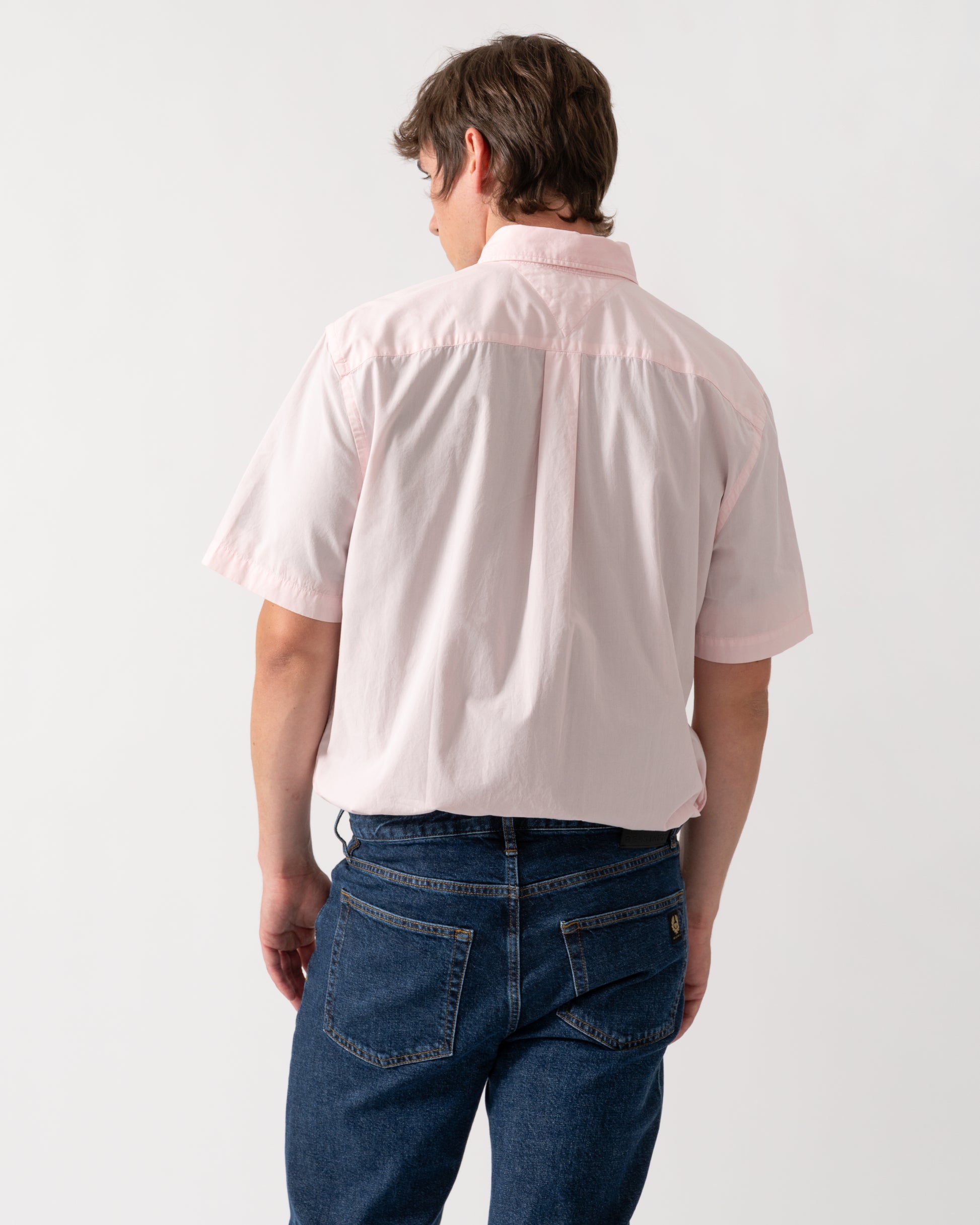 back of model wearing a Tommy Hilfiger GMD Poplin Mens Short Sleeve Shirt in Pink Lily