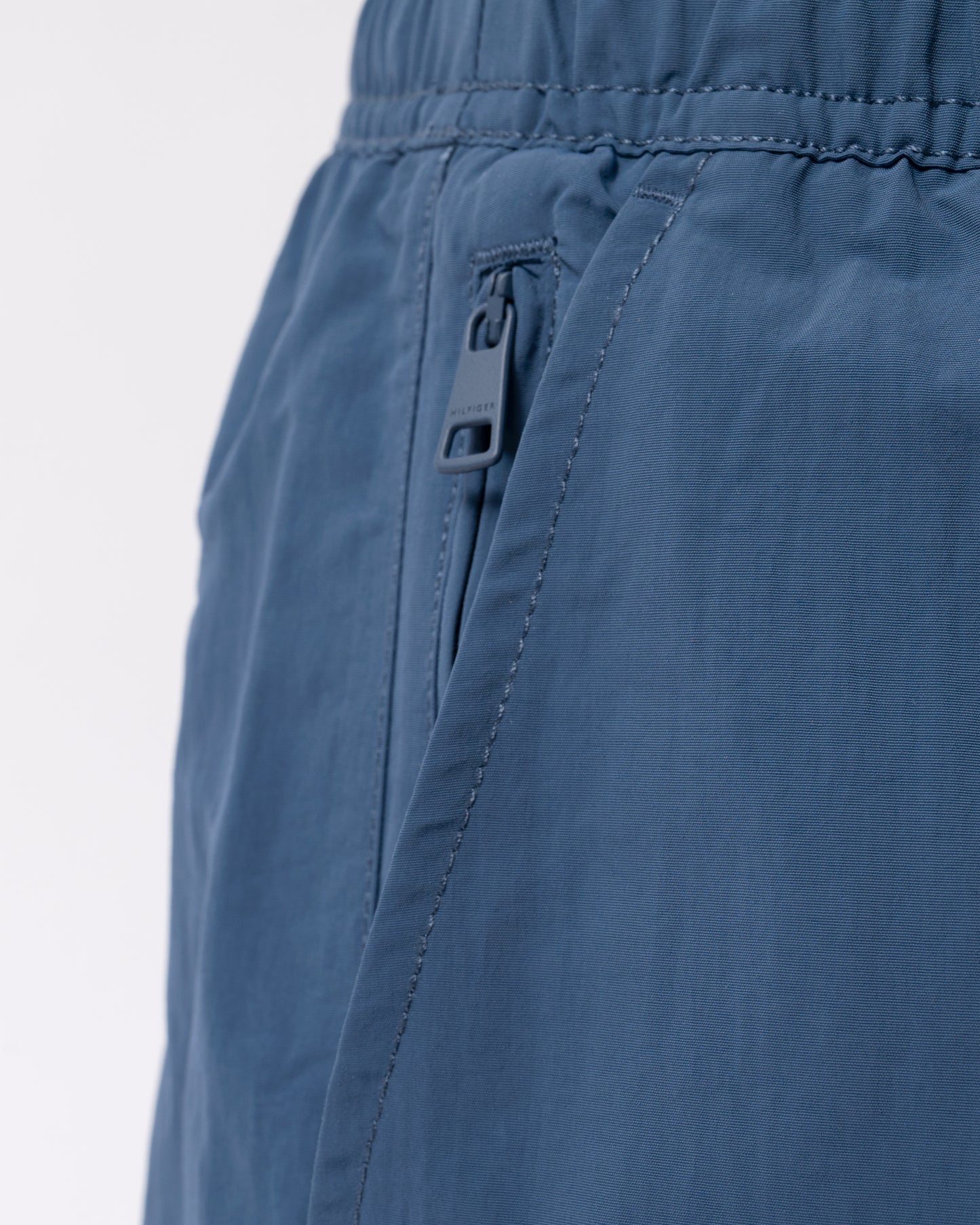 detail of Tommy Hilfiger Logo Zip Pocket Mens Drawstring Swimming Shorts in Aegean Sea