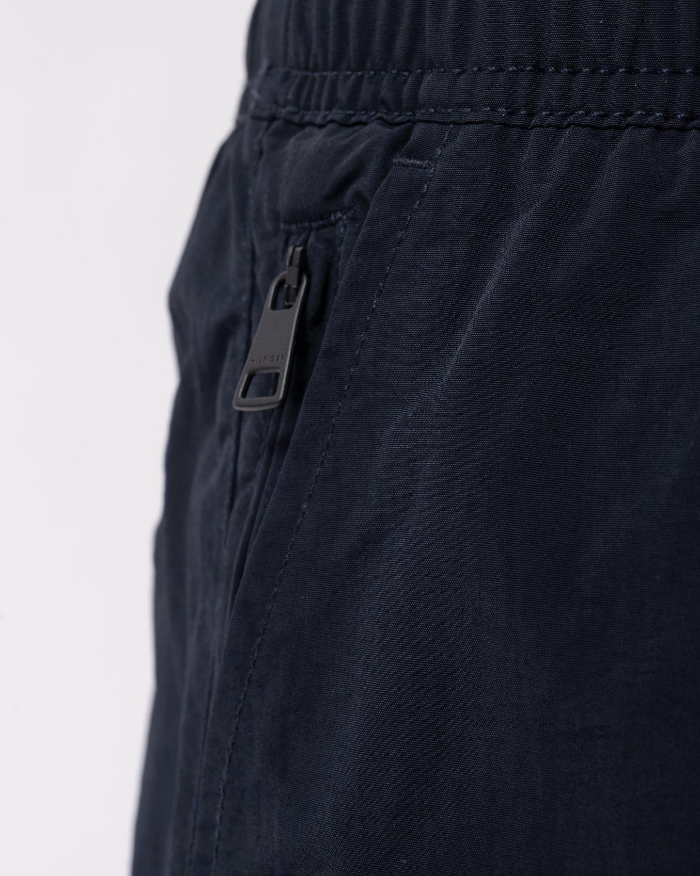 pocket detail of Tommy Hilfiger Logo Zip Pocket Mens Drawstring Swimming Shorts in Desert Sky