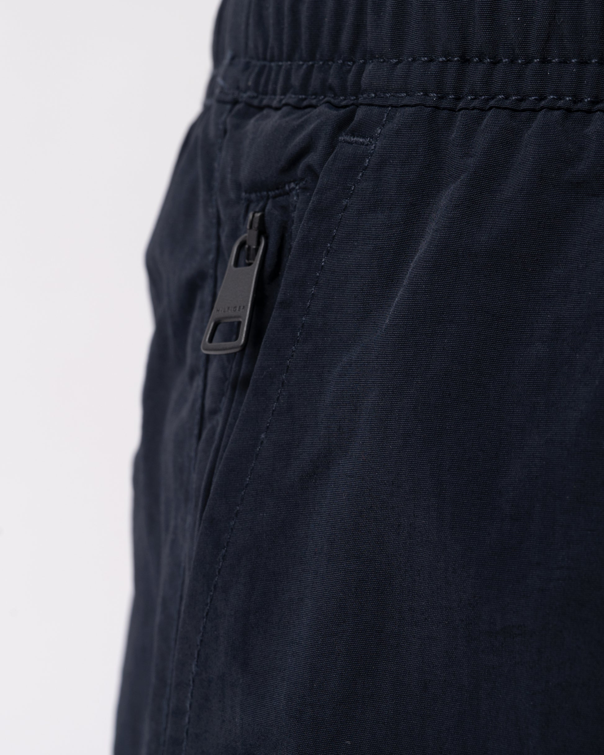 pocket detail of Tommy Hilfiger Logo Zip Pocket Mens Drawstring Swimming Shorts in Desert Sky