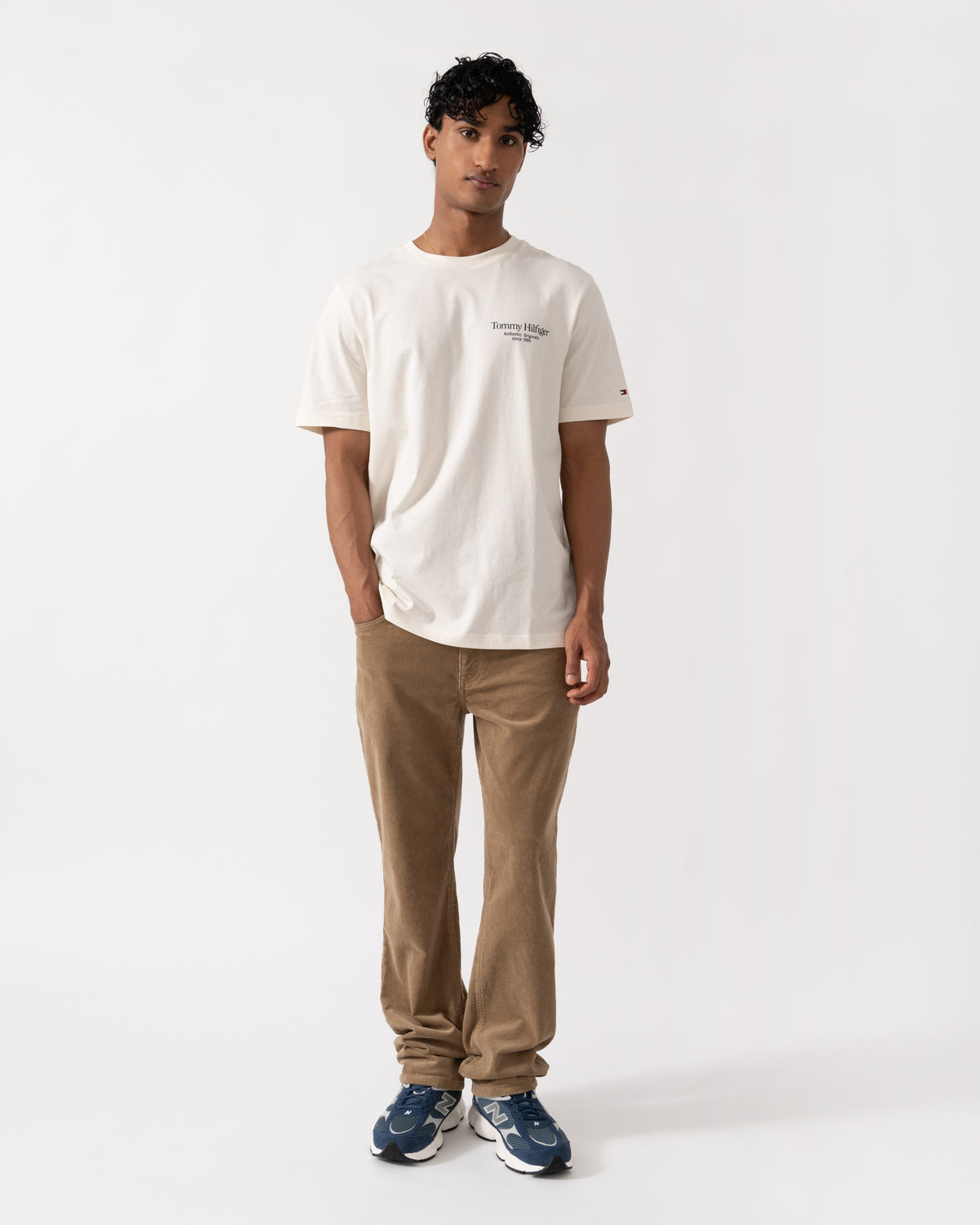 Model wearing the Tommy Hilfiger Mens Back Text Seasonal Graphic T-Shirt - Ivory Petal