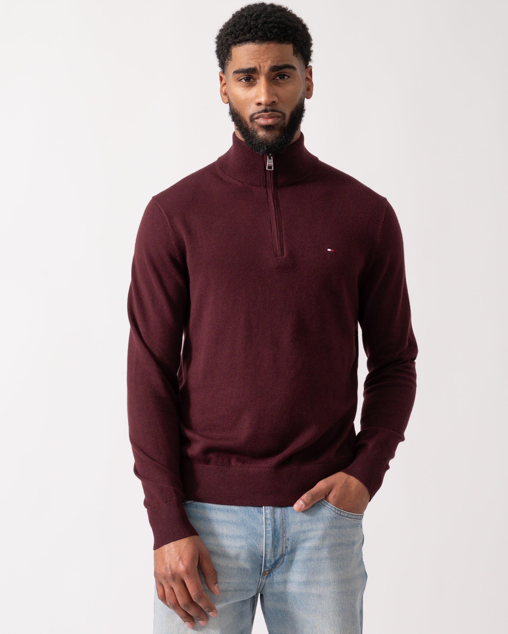 model wearing a Tommy Hilfiger Organic Cotton Cashmere Mens Zip-Mock Sweater in Deep Burgundy