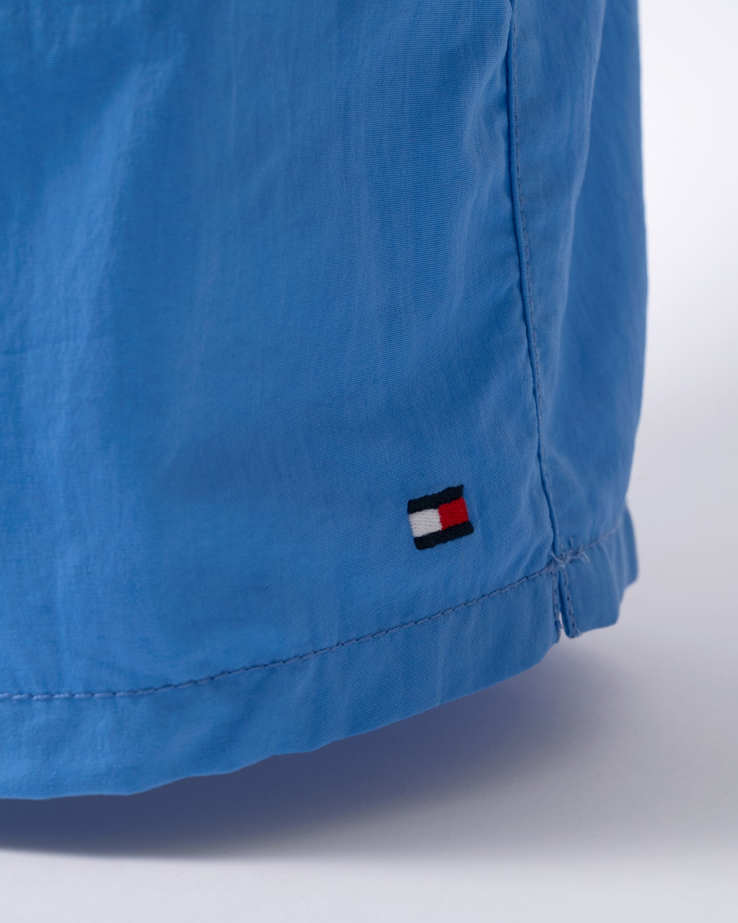 logo detail of of Tommy Hilfiger Solid Mens Drawstring Swimming Shorts in Blue Spell