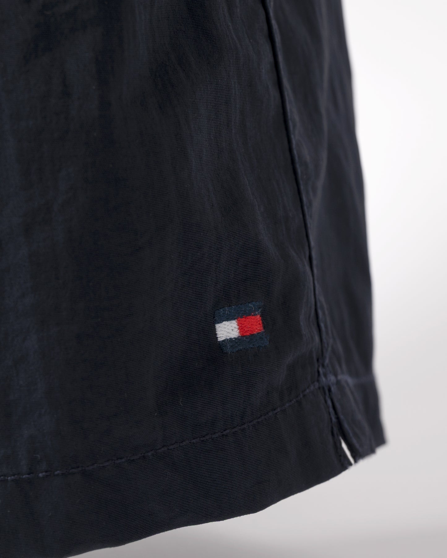 logo detail of Tommy Hilfiger Solid Mens Drawstring Swimming Shorts in Desert Sky