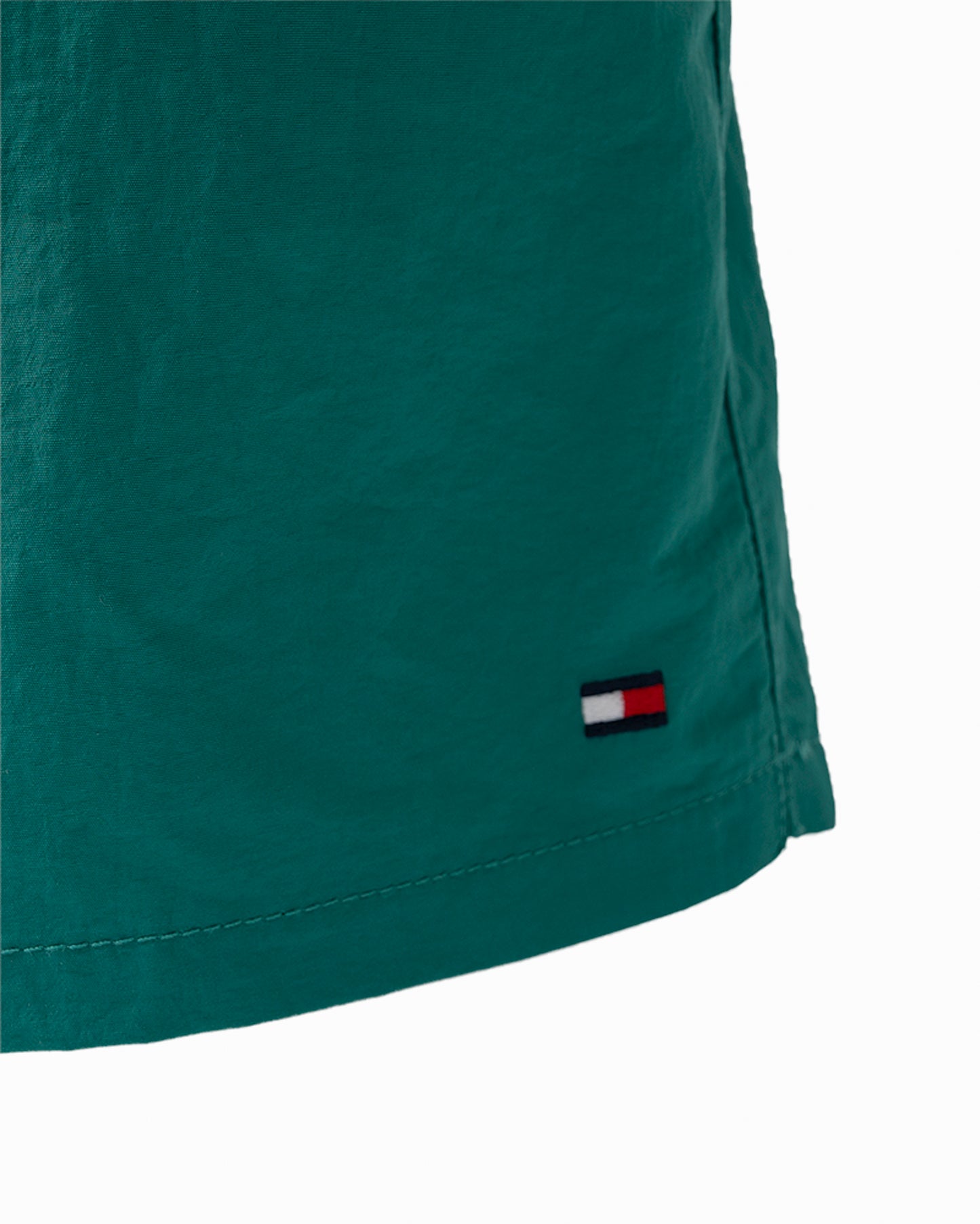 logo detail of Tommy Hilfiger Solid Mens Drawstring Swimming Shorts in Rainforest Emerald