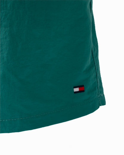 logo detail of Tommy Hilfiger Solid Mens Drawstring Swimming Shorts in Rainforest Emerald