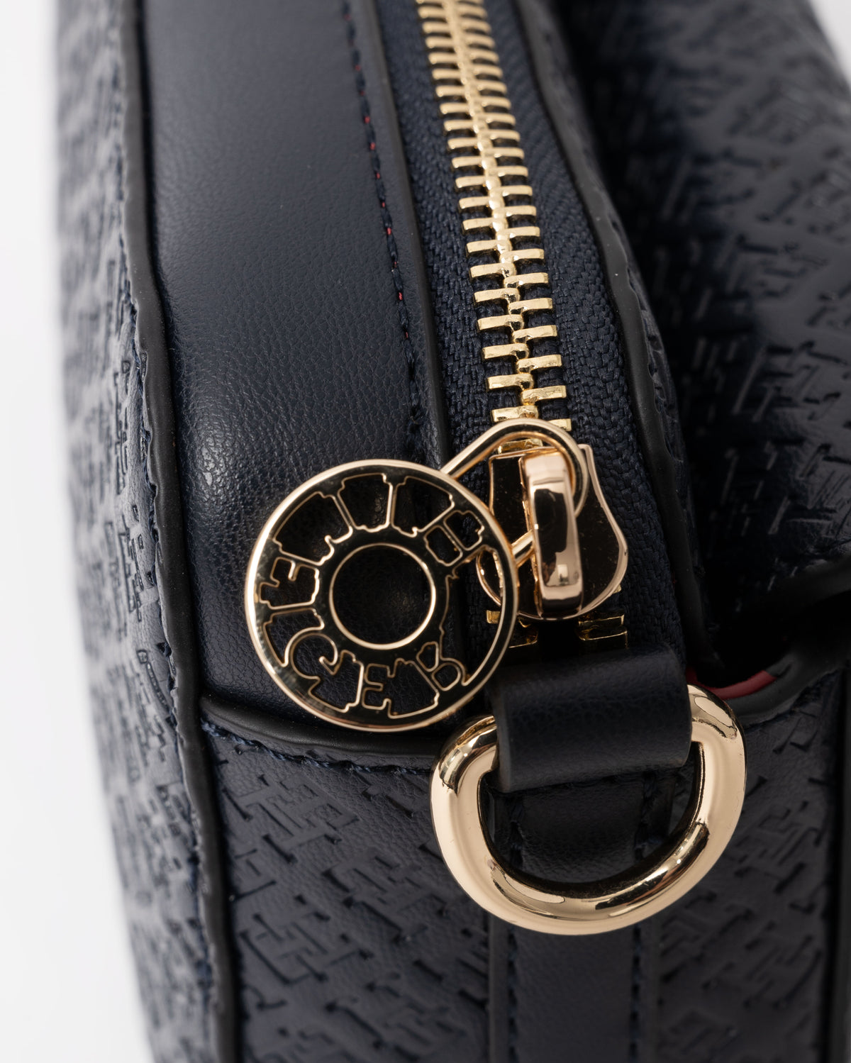 Zip detail on the Tommy Hilfiger TH Icon Womens Mono Print Camera Bag - Space Blue