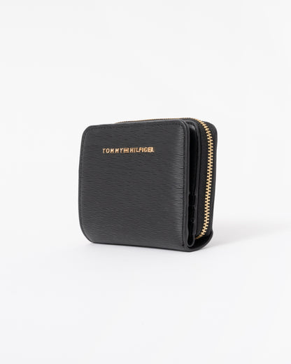 Left side of the Tommy Hilfiger TH Modern Womens Medium Zip Wallet - Black