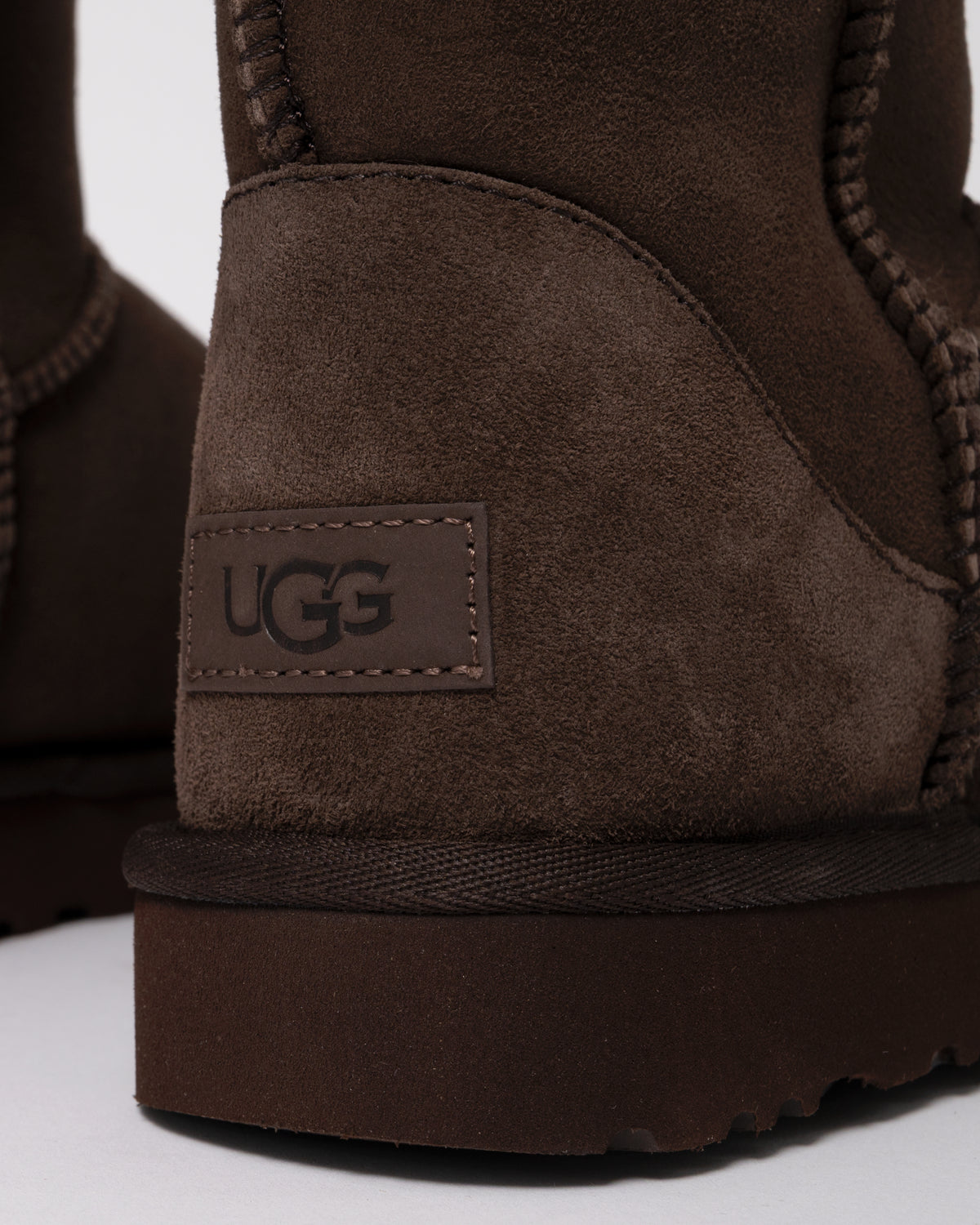 Studio photograph showing heel detail of UGG Classic Short II Womens Boots in Dusted Cocoa