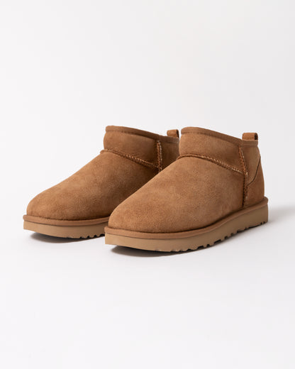 a pair of UGG Classic Ultra Mini Womens Boot in Chestnut