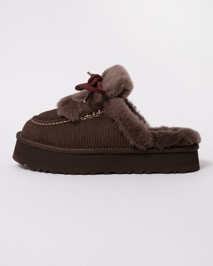 Studio photograph showing side of UGG Womens Disquette Heritage Slippers in Burnt Cedar