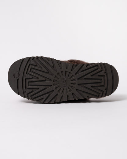 Studio photograph showing sole of UGG Womens Disquette Heritage Slippers in Burnt Cedar