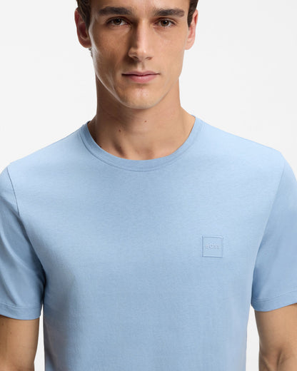 Model wearing BOSS Orange Tales Mens Cotton-Jersey T-shirt With Logo Patch - Light/Pastel Blue 458 - Close up