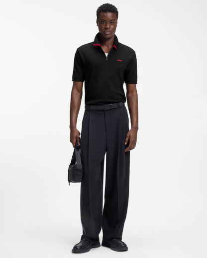 Model wearing HUGO Dalomino Mens Short Sleeve Zip Placket Polo Shirt with Contrast Logo in Black 002 - Full length
