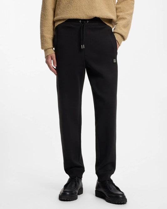 HUGO Dimacs Mens Cotton - blend tracksuit bottoms with stacked logo - Black 002 | CHO | Designer Mens,Trousers,Joggers