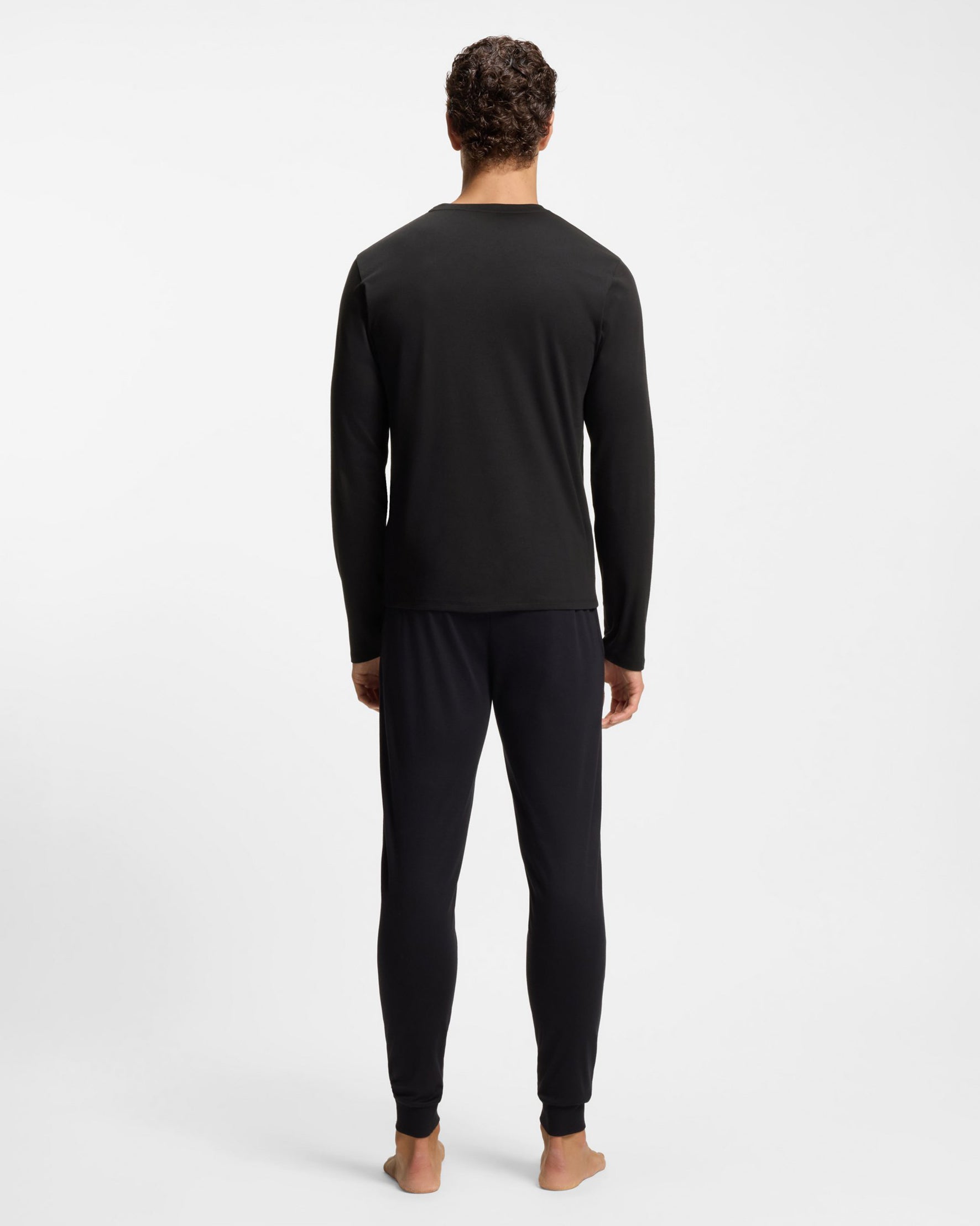 model wearing BOSS Orange Mens Xmas Long Pyjama Gift Set back