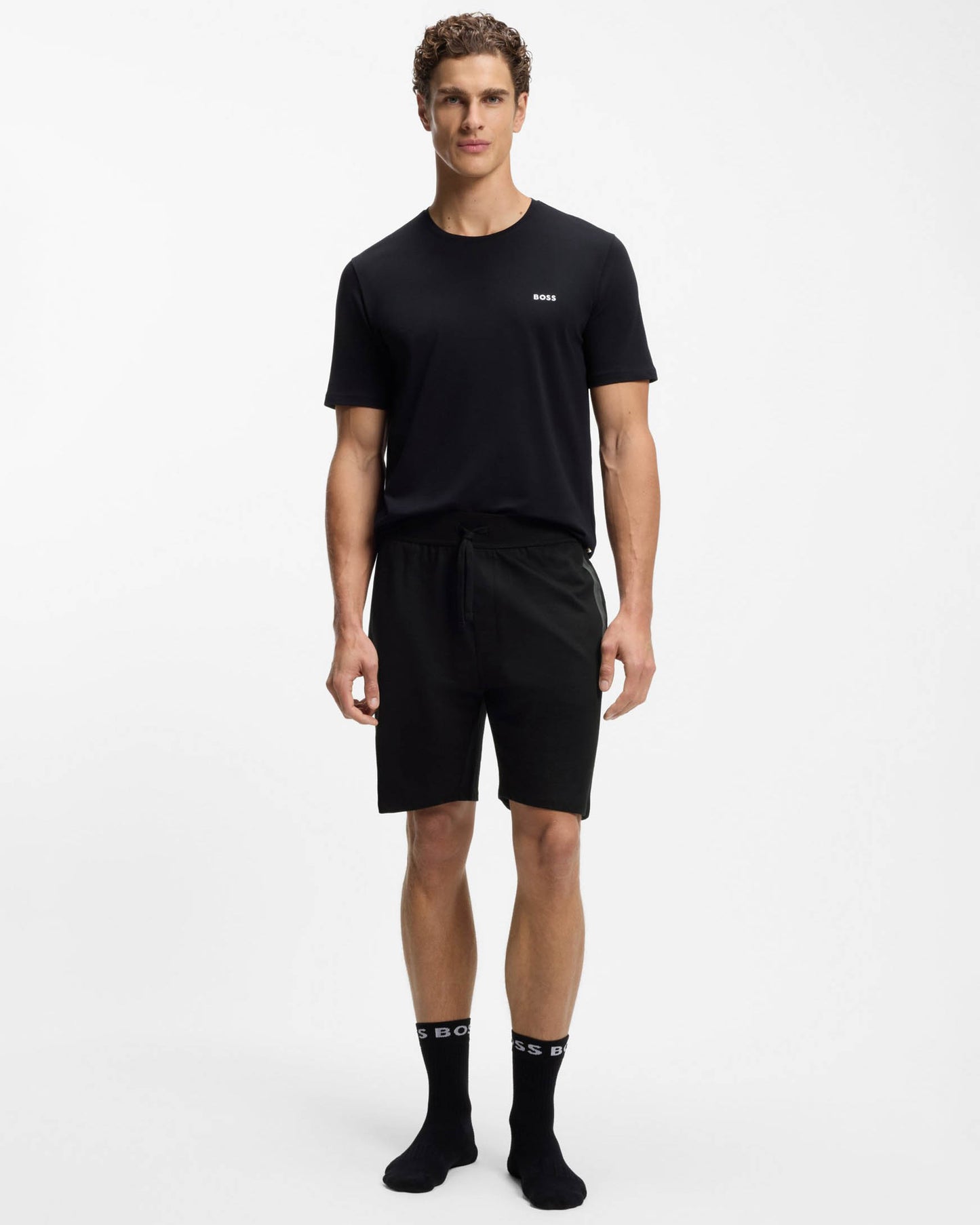 Model Wearing BOSS Orange Authentic Mens Loungewear Shorts with Stripe and Logo in Black 004 - Full length