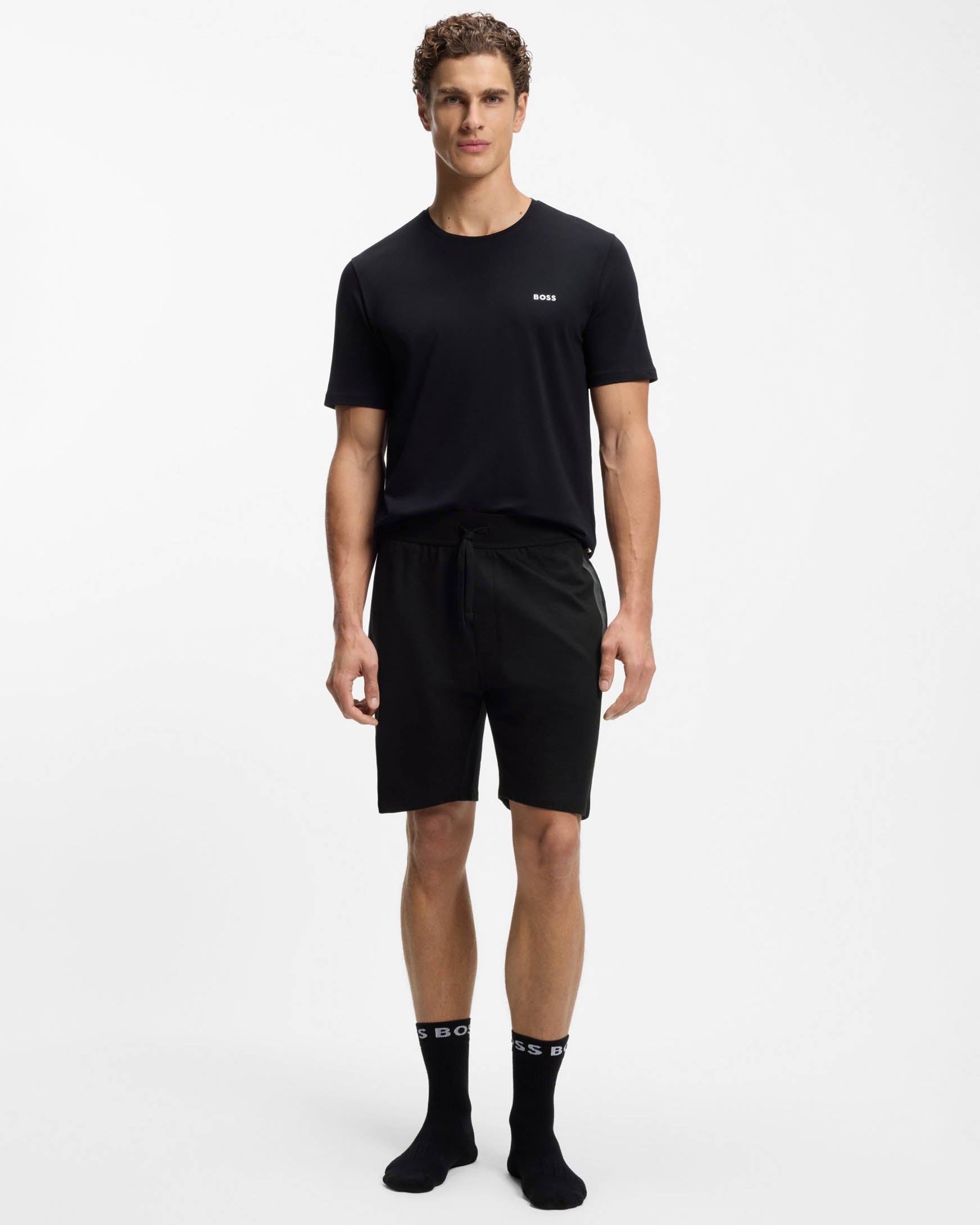 Model Wearing BOSS Orange Authentic Mens Loungewear Shorts with Stripe and Logo in Black 004 - Full length