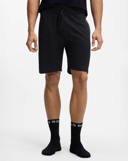 Model wearing BOSS Orange Authentic Mens Loungewear Shorts with Stripe and Logo in Black 004 - Front