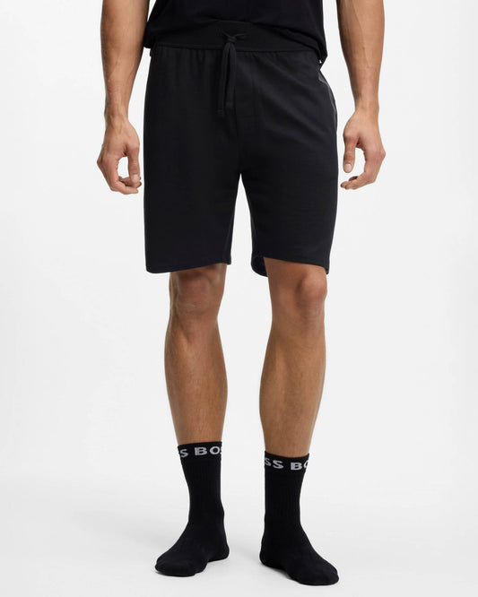 Model wearing BOSS Orange Authentic Mens Loungewear Shorts with Stripe and Logo in Black 004 - Front