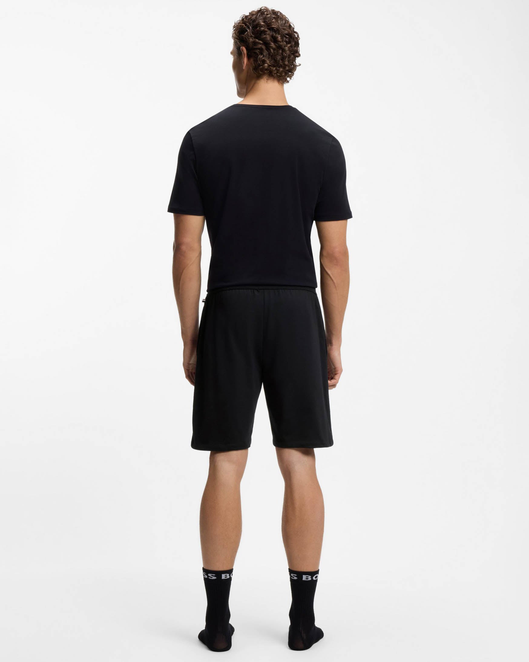 Model Wearing BOSS Orange Authentic Mens Loungewear Shorts with Stripe and Logo in Black 004 - Back