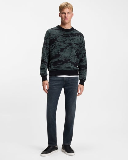 Model wearing BOSS Orange ReMaine Mens Jeans 50555289 in Dark Blue 408 - Full body