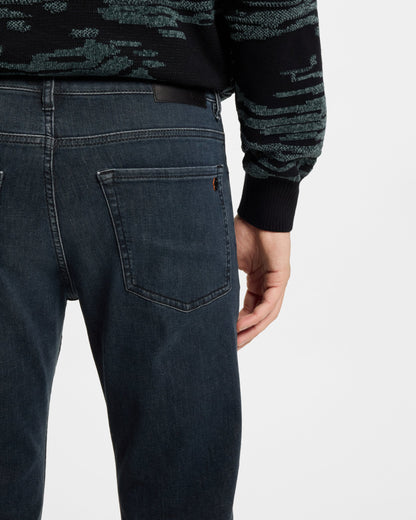 Model wearing BOSS Orange ReMaine Mens Jeans 50555289 in Dark Blue 408 - close up