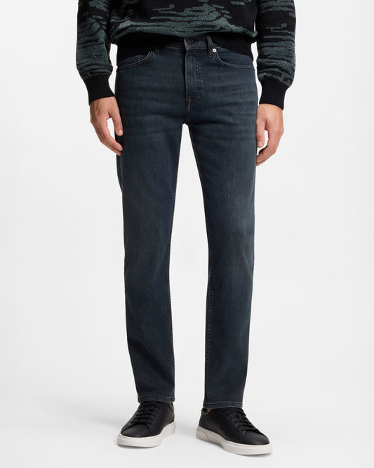 Model wearing BOSS Orange ReMaine Mens Jeans 50555289 in Dark Blue 408 - Front