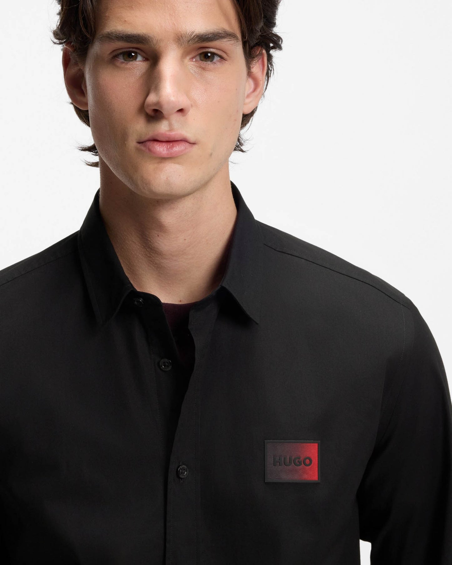 Model wearing HUGO Mens Emero Mens Relaxed-Fit Shirt in Stretch-Cotton Canvas in Black 001 - close up